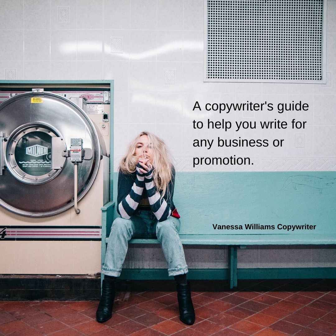 Girl with long blonde hair in a launderette, sitting on a blue bench next to a big dryer.
